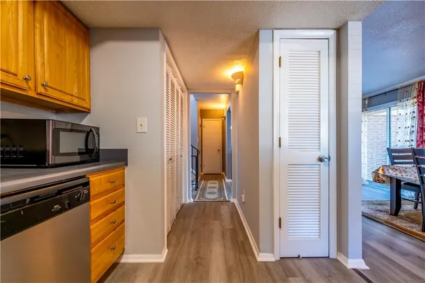 a view of a kitchen from the hallway
