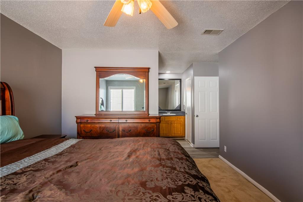 3301 Henderson Mill Road, Unit X4 Atlanta, GA 30341 - Photo 23 of 36 a bedroom with a bed and a dresser