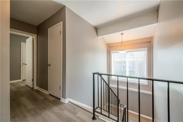 a view of a porch with wooden floor