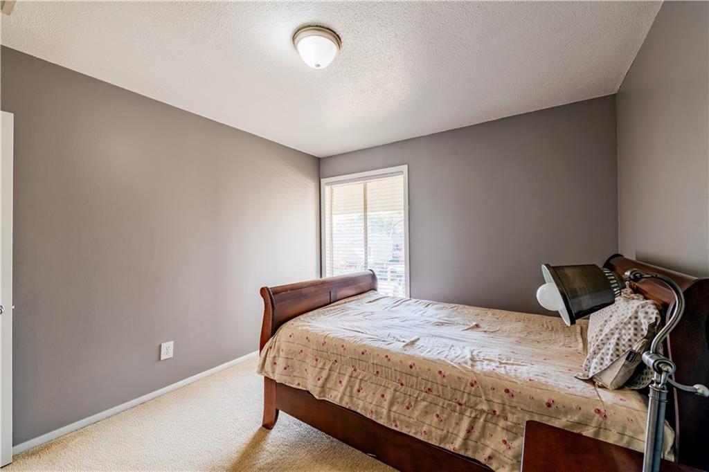 3301 Henderson Mill Road, Unit X4 Atlanta, GA 30341 - Photo 28 of 36 a bedroom with a bed and a window