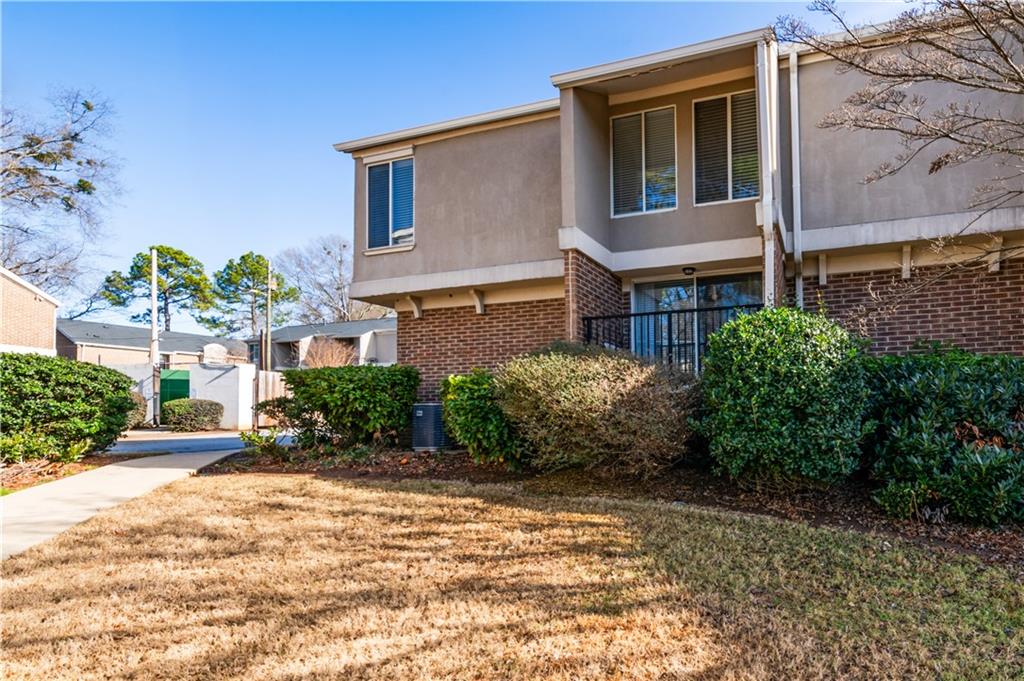 3301 Henderson Mill Road, Unit X4 Atlanta, GA 30341 - Photo 35 of 36 a view of a house with a yard and potted plants