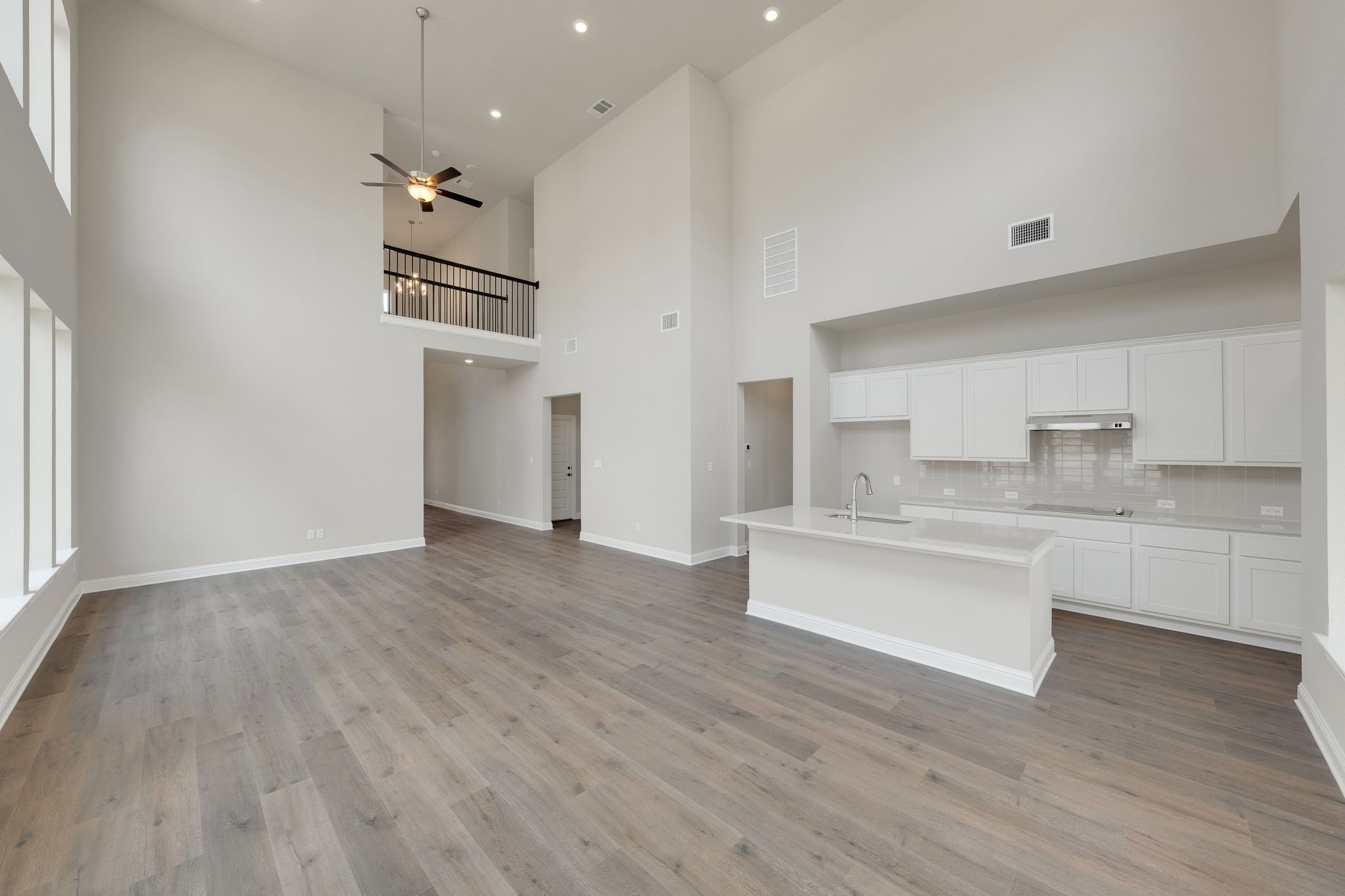 216 Crescent Heights Drive Georgetown, TX 78628 - Photo 10 of 30 a kitchen with stainless steel appliances granite countertop a dishwasher a stove and a wooden floors