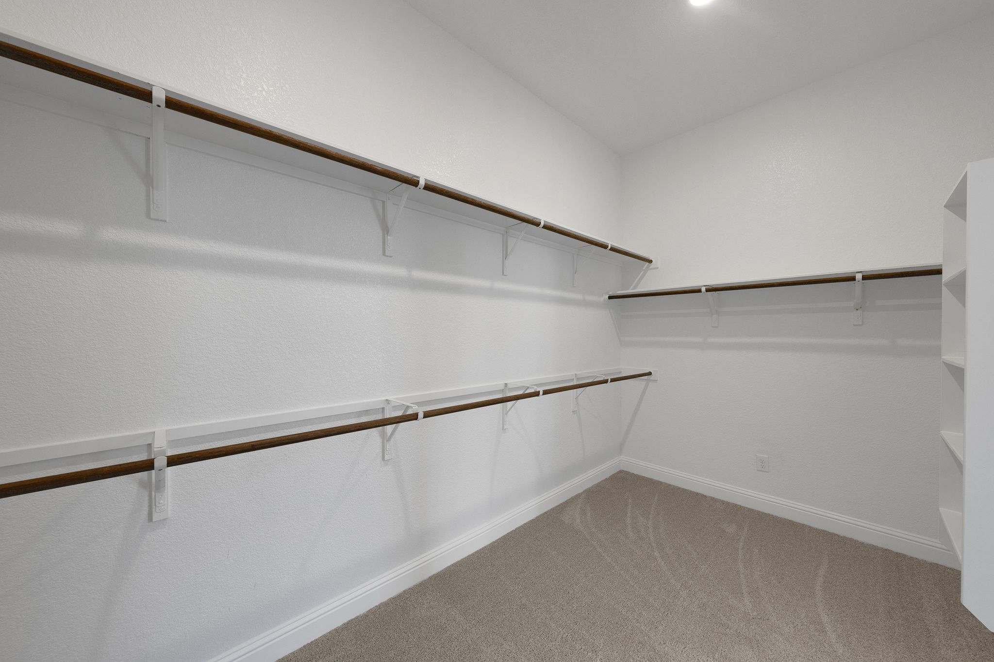 216 Crescent Heights Drive Georgetown, TX 78628 - Photo 14 of 30 a view of a room with racks on the wall