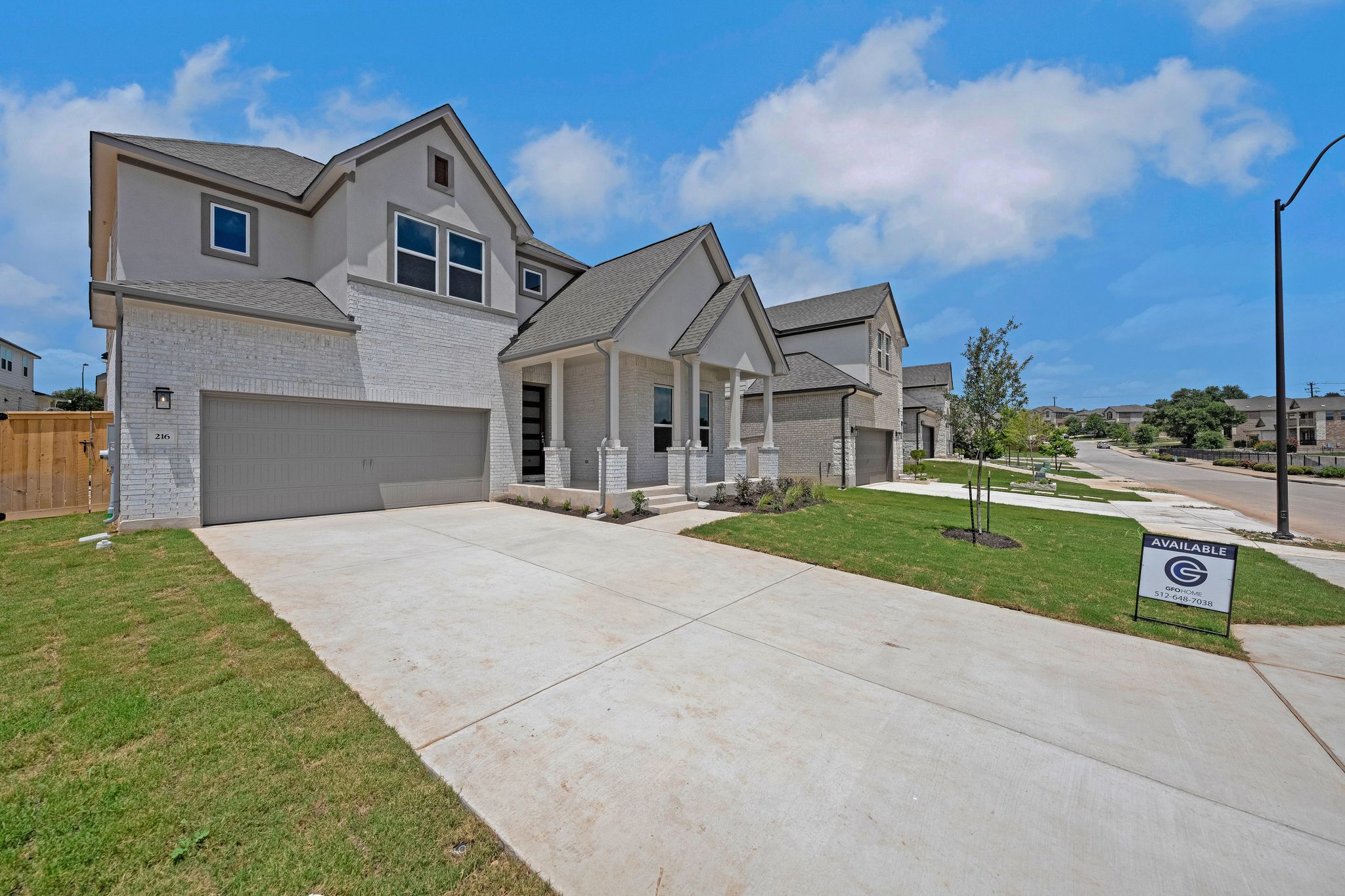 216 Crescent Heights Drive Georgetown, TX 78628 - Photo 3 of 30 a front view of a house with a yard and garage