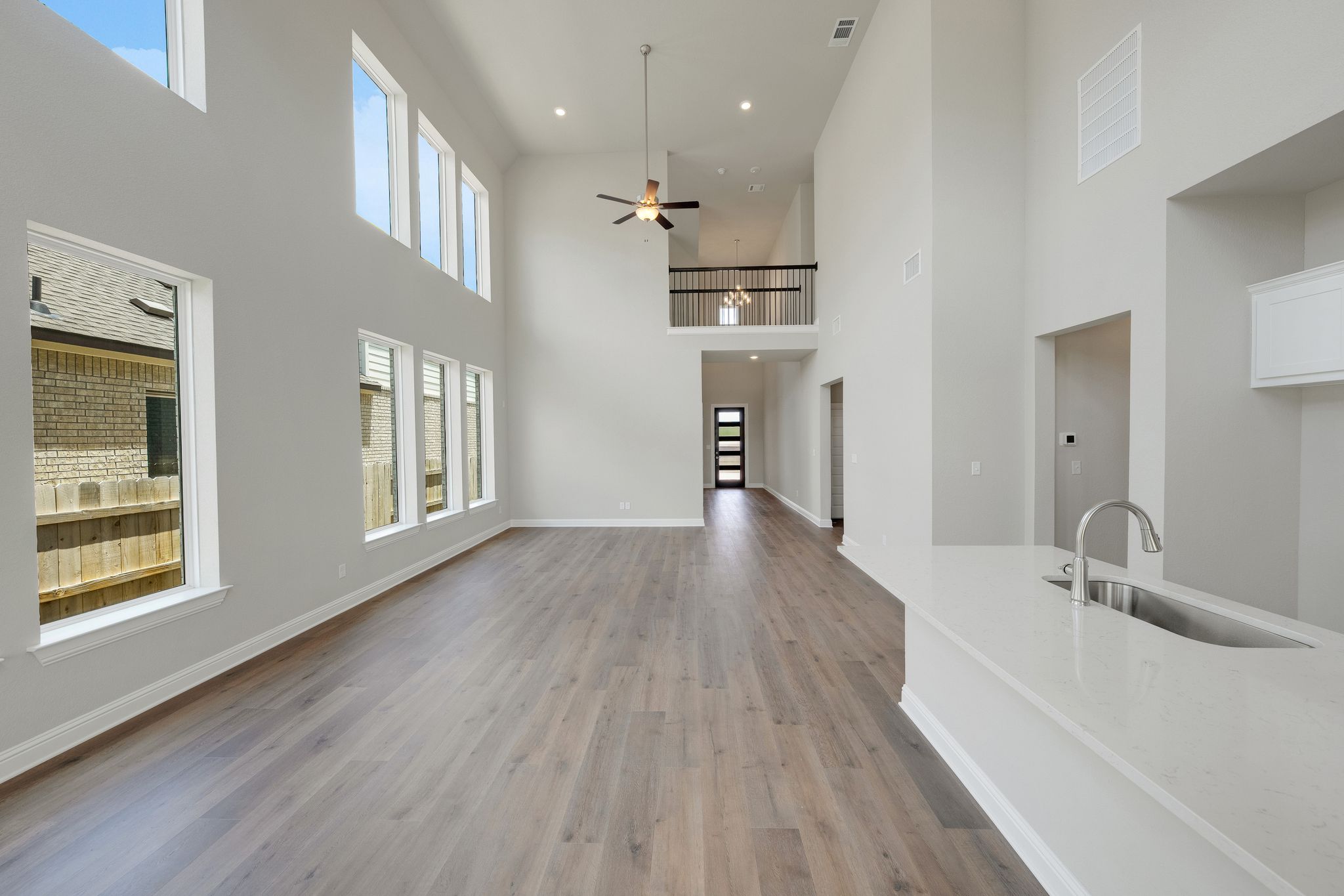 216 Crescent Heights Drive Georgetown, TX 78628 - Photo 5 of 30 a view of a kitchen cabinets and wooden floor