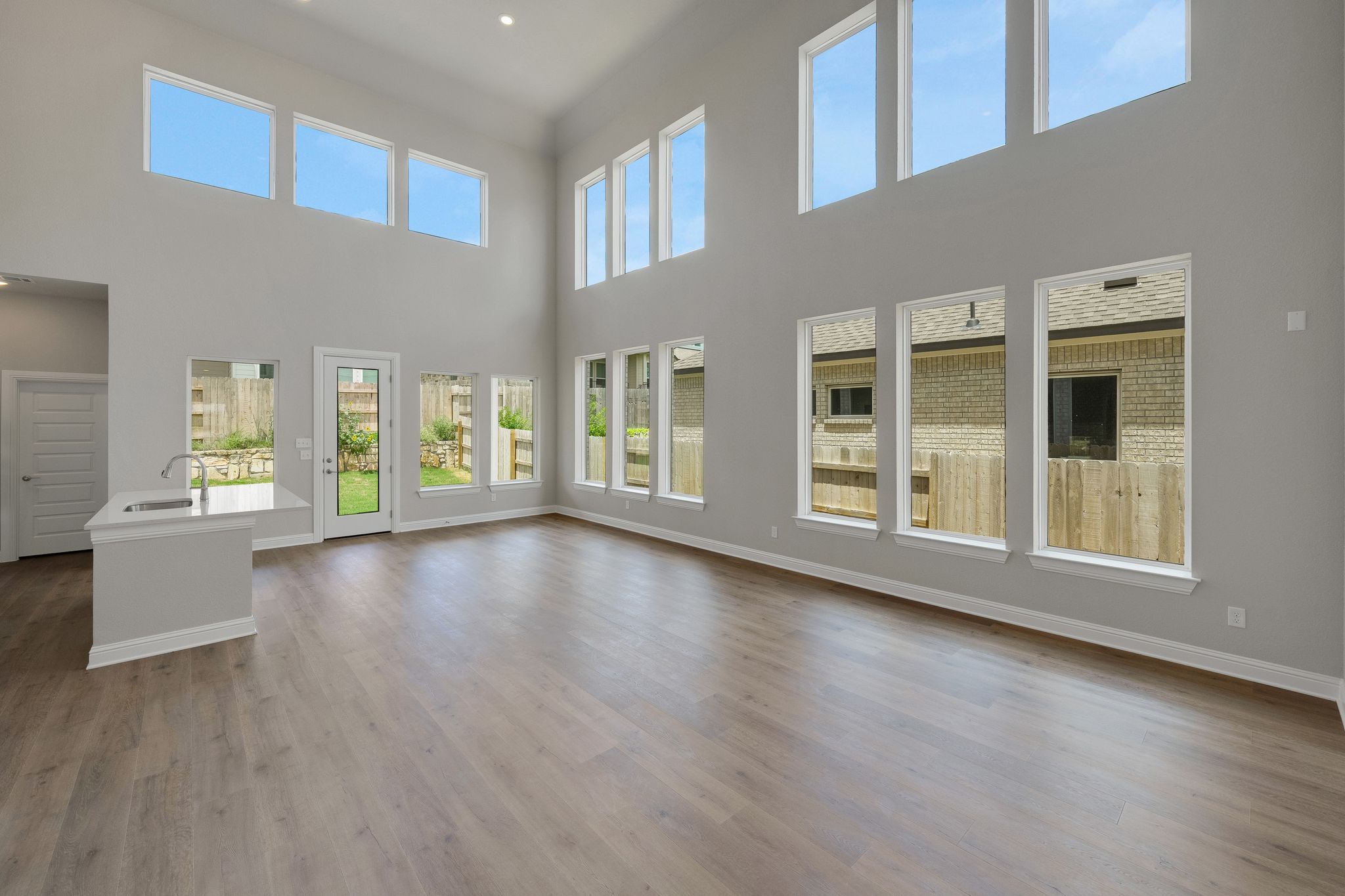 216 Crescent Heights Drive Georgetown, TX 78628 - Photo 6 of 30 a view of an empty room with wooden floor and a window