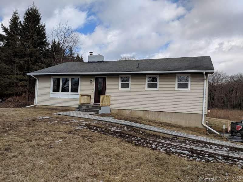 365 Mack Road Lebanon, CT 06249 - Photo 1 of 1 a front view of a house with a garden