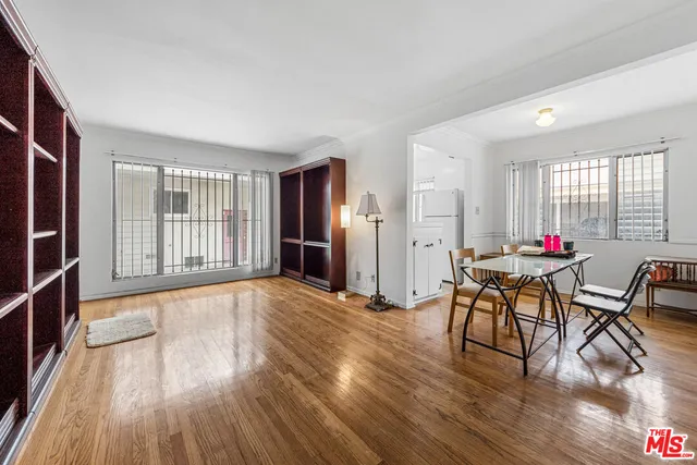 a view of a dining room with furniture and a window