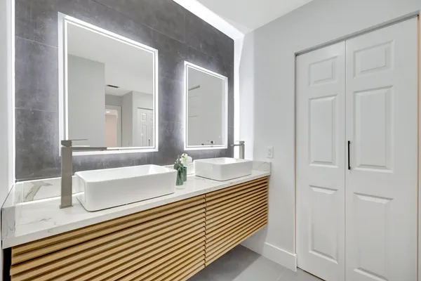 a bathroom with a sink and a mirror