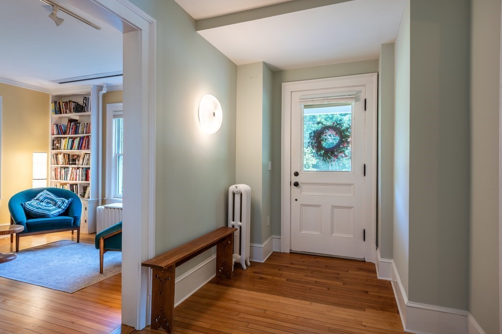 54 Snell Street Amherst, MA 01002 - Photo 11 of 42 a view of an entryway with wooden floor and furniture