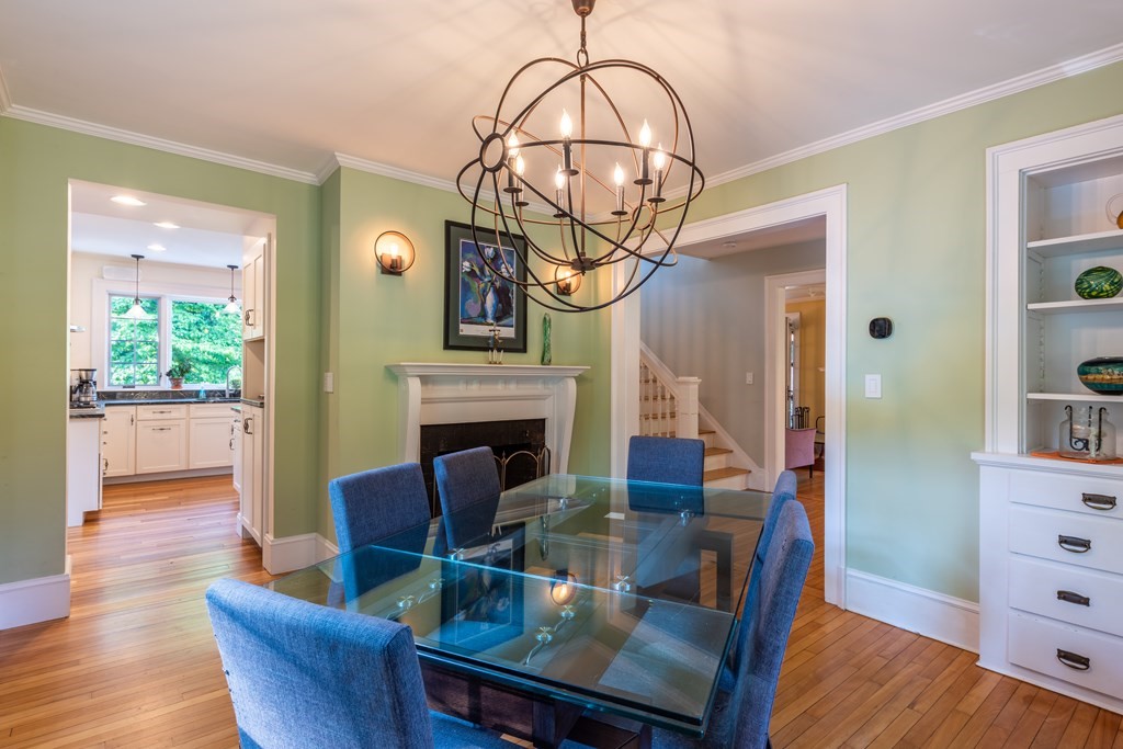 54 Snell Street Amherst, MA 01002 - Photo 14 of 42 a view of a dining room with furniture wooden floor and a chandelier
