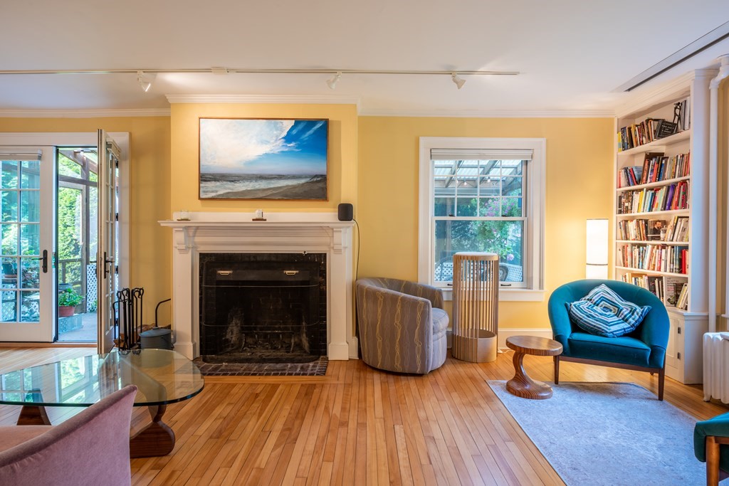 54 Snell Street Amherst, MA 01002 - Photo 16 of 42 a living room with furniture and a fireplace