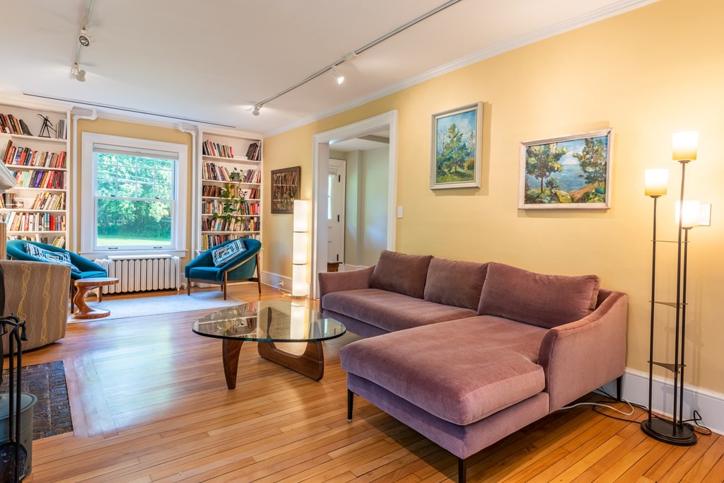 54 Snell Street Amherst, MA 01002 - Photo 19 of 42 a living room with furniture and a wooden floor