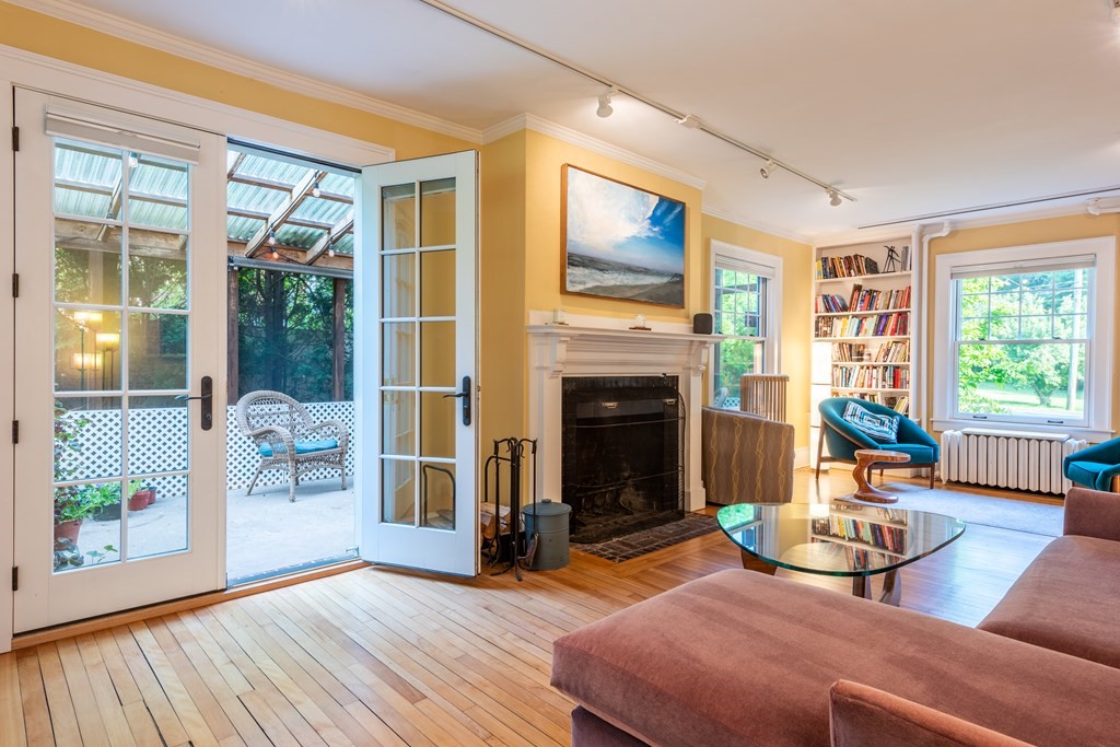 54 Snell Street Amherst, MA 01002 - Photo 20 of 42 a living room with furniture and a fireplace