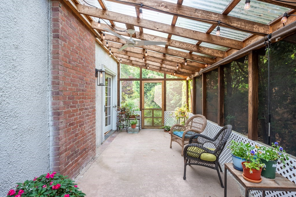 54 Snell Street Amherst, MA 01002 - Photo 22 of 42 a building outdoor space with patio furniture and potted plants
