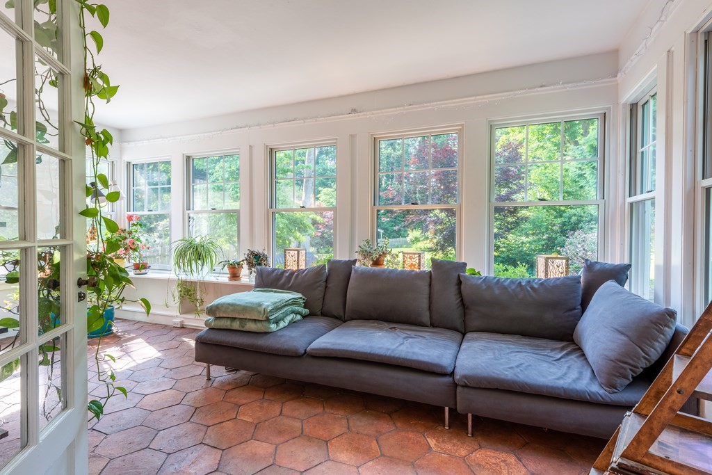 54 Snell Street Amherst, MA 01002 - Photo 23 of 42 a living room with furniture and a large window
