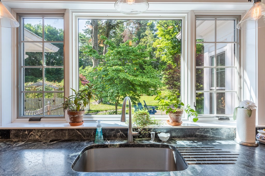 54 Snell Street Amherst, MA 01002 - Photo 26 of 42 a living room filled with furniture and a potted plant