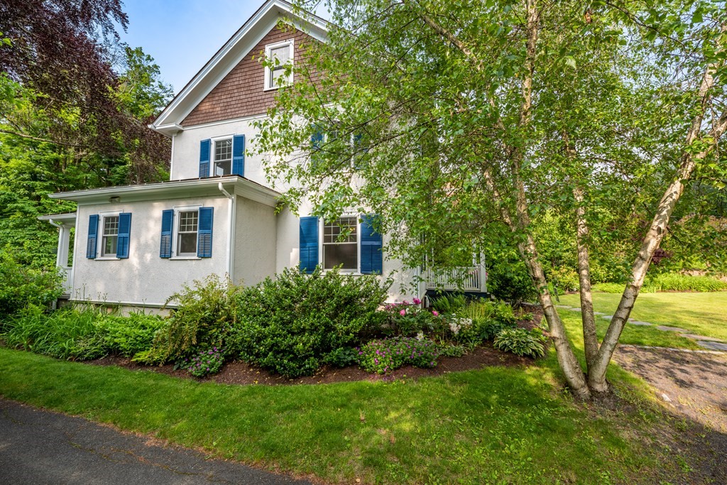 54 Snell Street Amherst, MA 01002 - Photo 3 of 42 a front view of a house with a yard