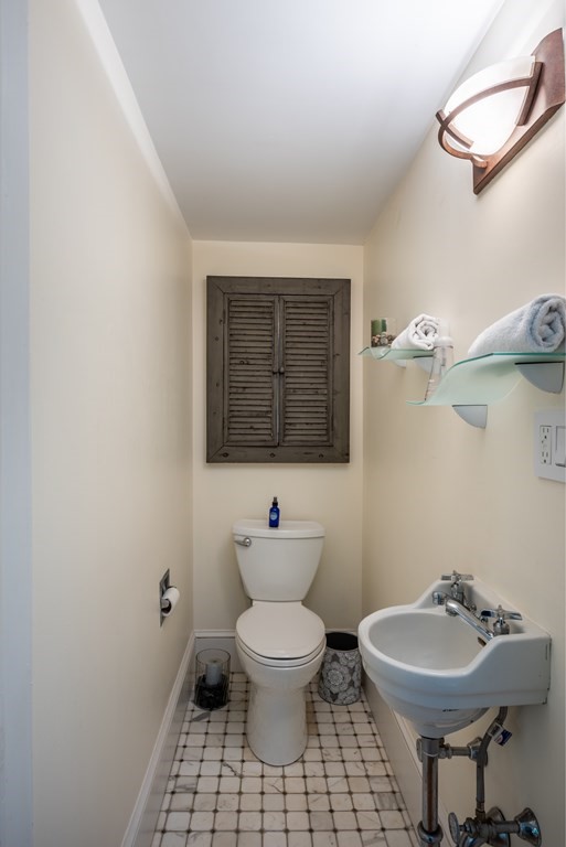 54 Snell Street Amherst, MA 01002 - Photo 31 of 42 a bathroom with a sink toilet and a mirror