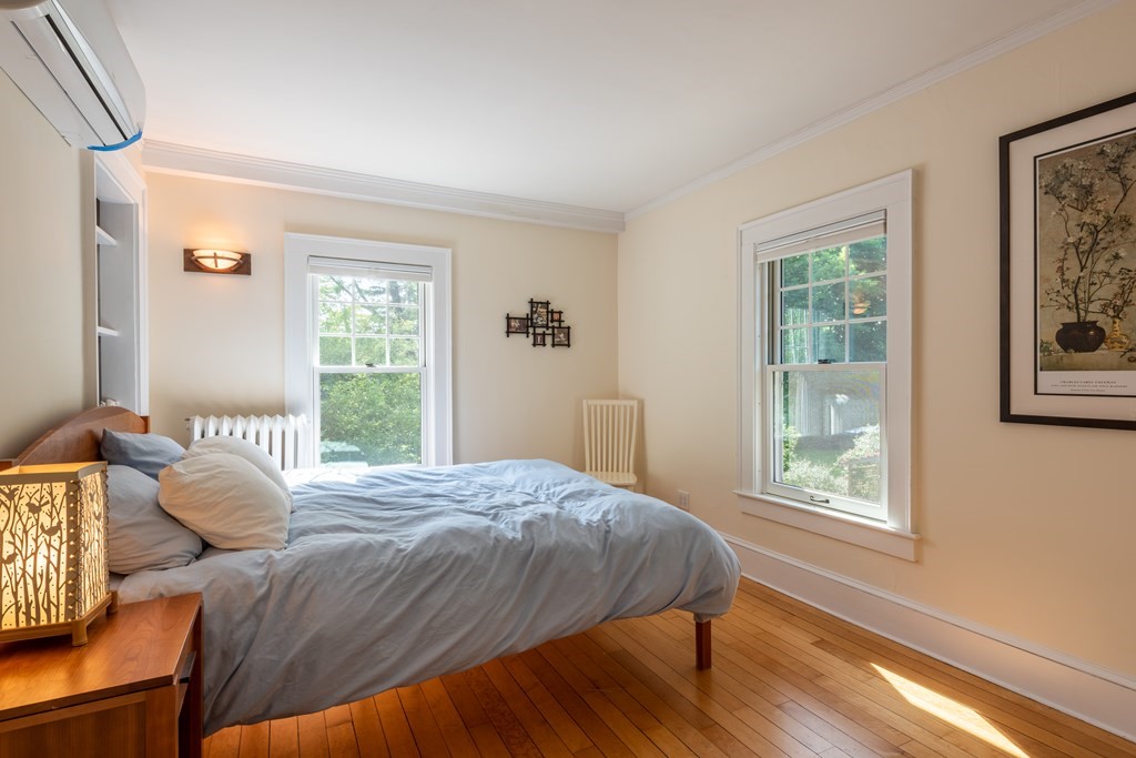 54 Snell Street Amherst, MA 01002 - Photo 32 of 42 a bedroom with a bed and a window