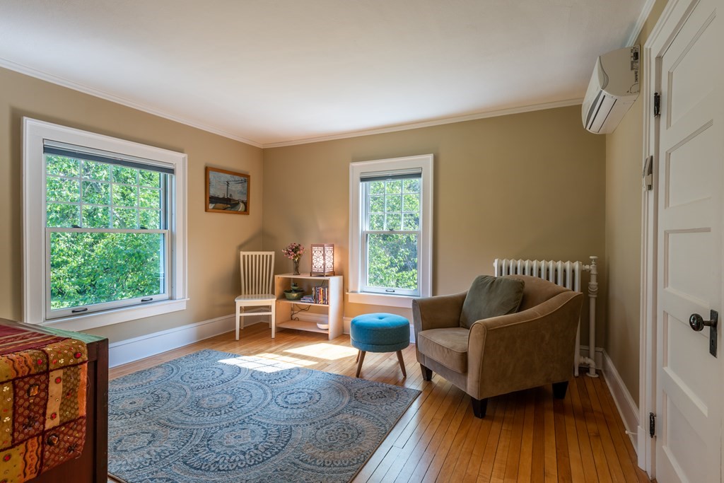 54 Snell Street Amherst, MA 01002 - Photo 33 of 42 a living room with furniture and a window
