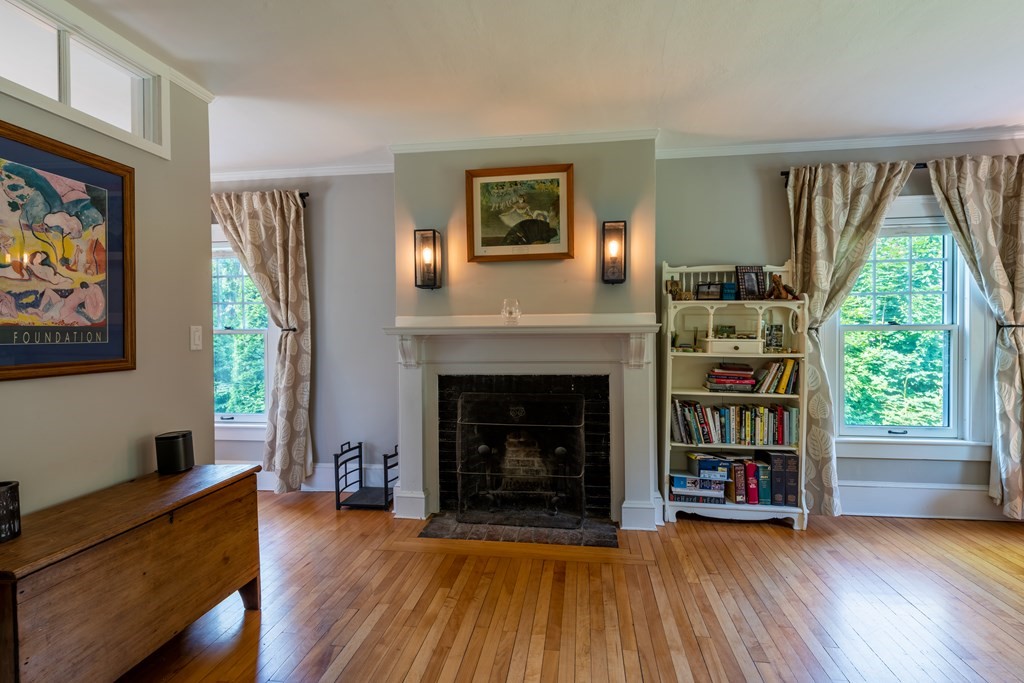 54 Snell Street Amherst, MA 01002 - Photo 36 of 42 a living room with furniture and a fireplace