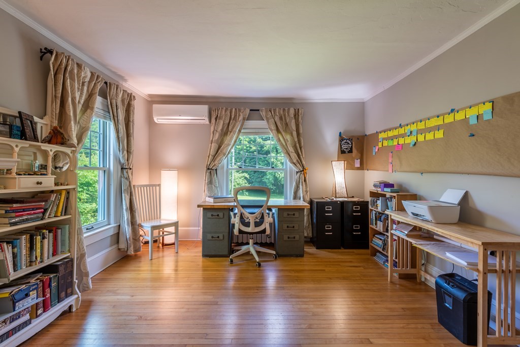 54 Snell Street Amherst, MA 01002 - Photo 37 of 42 a living room with furniture and a wooden floor