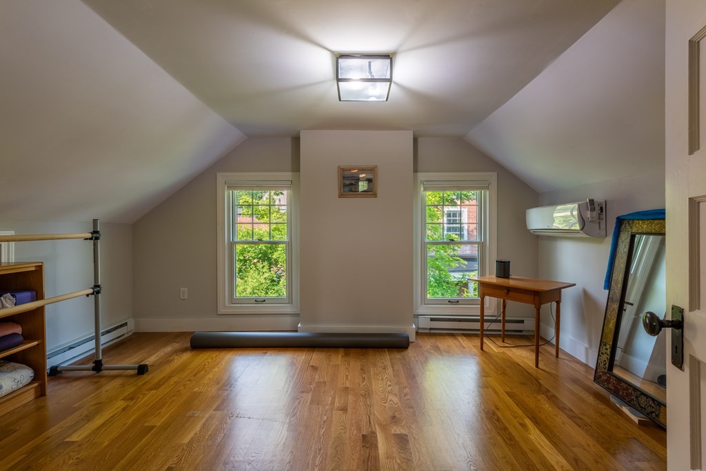 54 Snell Street Amherst, MA 01002 - Photo 40 of 42 wooden floor in an empty room with a window