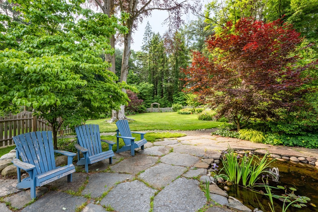 54 Snell Street Amherst, MA 01002 - Photo 5 of 42 a view of a garden with wooden floor and outdoor seating