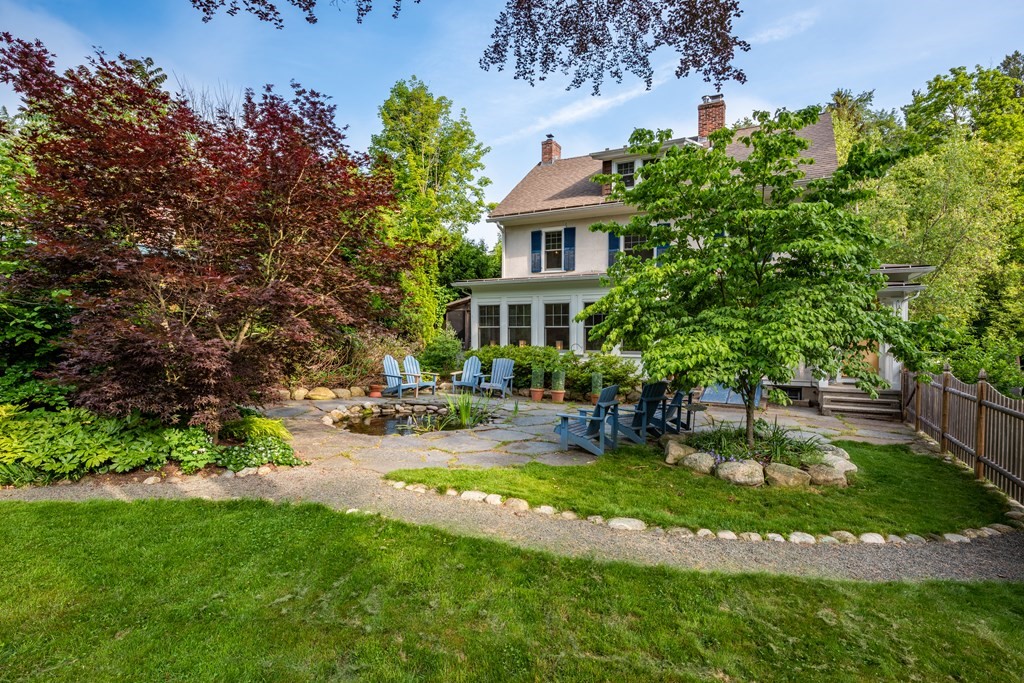 54 Snell Street Amherst, MA 01002 - Photo 6 of 42 a view of a backyard with plants and a patio