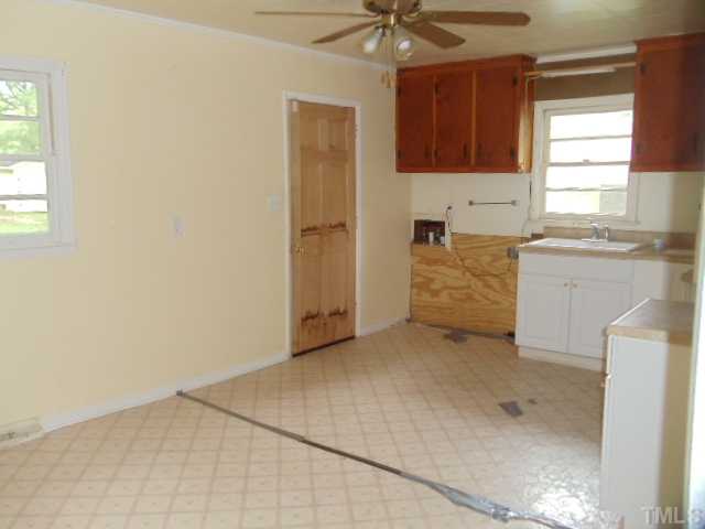 5302 Barbee Road Durham, NC 27713 - Photo 5 of 9 a view of kitchen with a sink cabinets and window