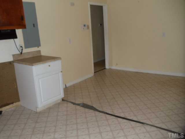 5302 Barbee Road Durham, NC 27713 - Photo 6 of 9 an empty room with wooden floor