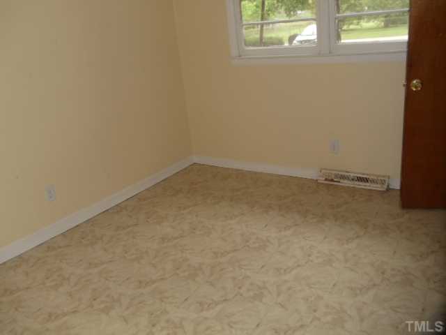5302 Barbee Road Durham, NC 27713 - Photo 7 of 9 an empty room with a window