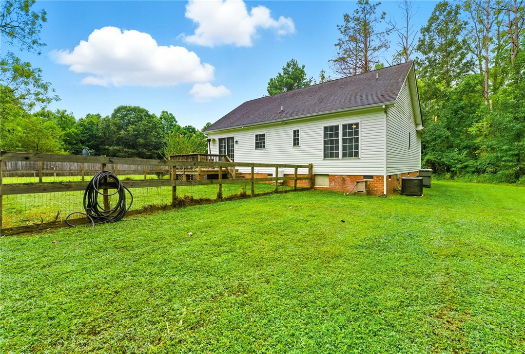 878 Salvia Road Newtown, VA 23126 - Photo 24 of 33 Back of house featuring a deck, a shingled roof, and crawl space