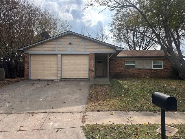 a front view of a house with yard
