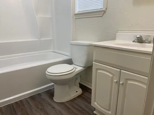 a bathroom with a toilet and a sink