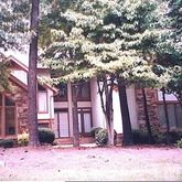 a backyard of a house with lots of green space