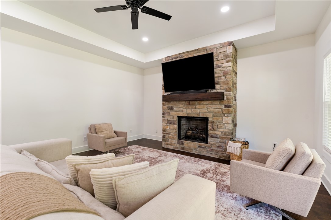 502 Canebrake Drive Anderson, SC 29621 - Photo 6 of 39 This inviting living area features a stone fireplace, dark hardwood flooring, and bright recessed lighting.