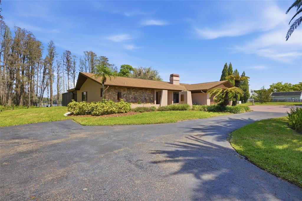 820 Newberger Road Lutz, FL 33549 - Photo 15 of 20 a front view of a house with garden
