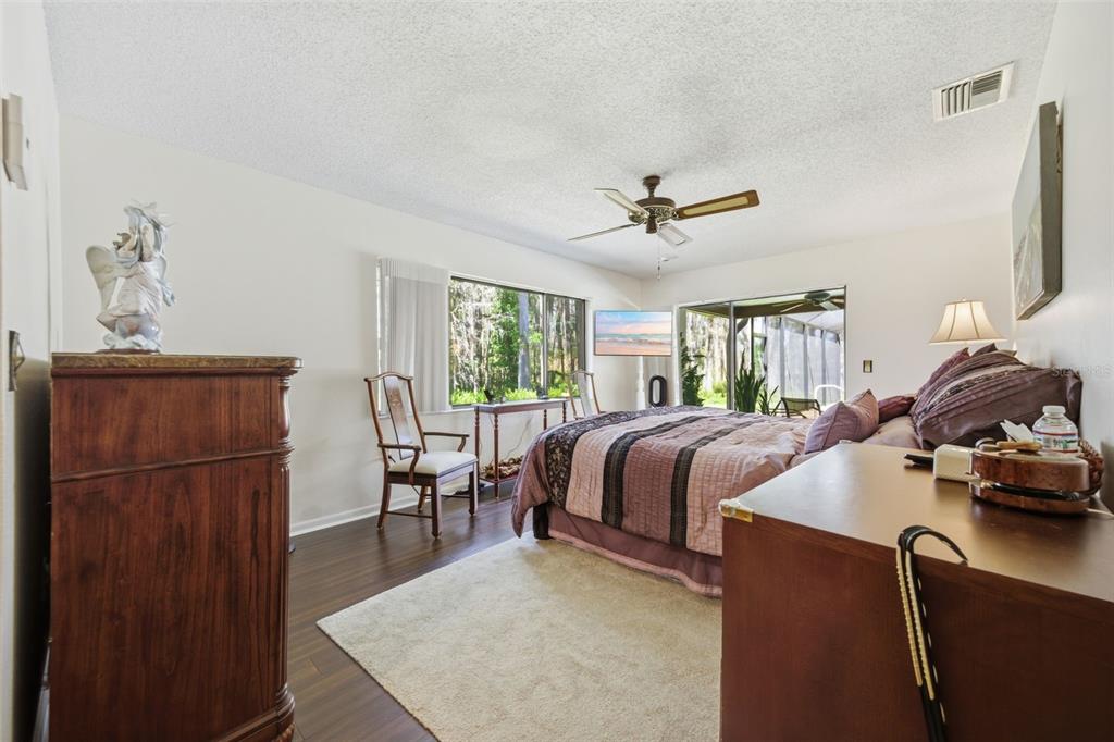 820 Newberger Road Lutz, FL 33549 - Photo 18 of 20 a bed room with a bed and a couch