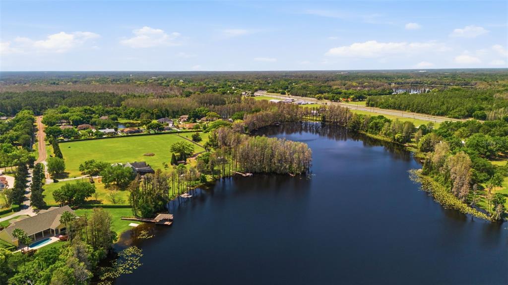 820 Newberger Road Lutz, FL 33549 - Photo 10 of 20 an aerial view of a city with lots of residential buildings ocean and mountain view in back