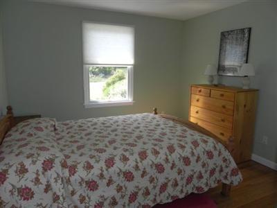 23 Meadowbrook Road Mashpee, MA 02649 - Photo 14 of 20 a bedroom with a bed and a window