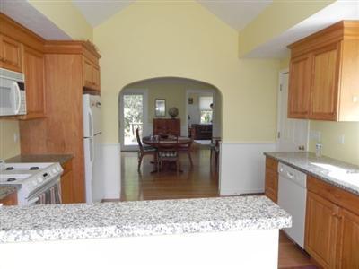 23 Meadowbrook Road Mashpee, MA 02649 - Photo 7 of 20 a kitchen with sink refrigerator and stove