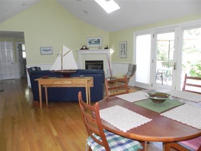 23 Meadowbrook Road Mashpee, MA 02649 - Photo 9 of 20 a living room with furniture and a fireplace