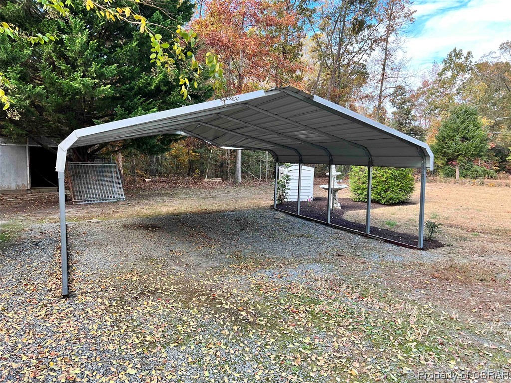 1295 Kates Neck Road Locust Hill, VA 23092 - Photo 11 of 24 View of parking / parking lot featuring a carport