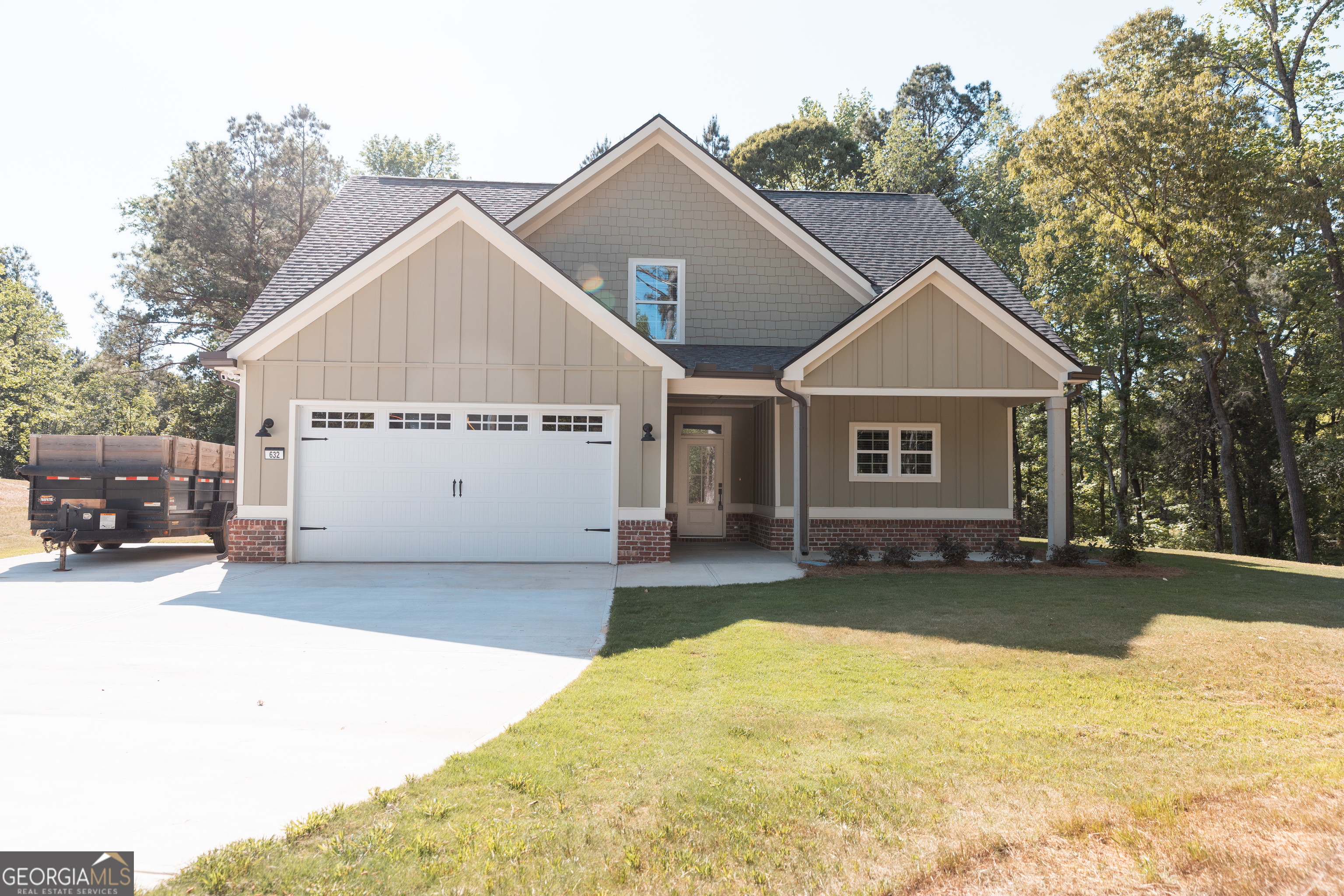 632 Campbell Road Covington, GA 30014 - Photo 3 of 60 a view of a house with a yard and garage