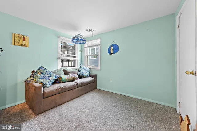 a bathroom with a sink toilet and a mirror
