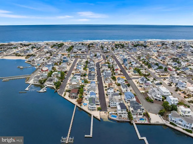 a balcony with table and chairs