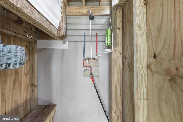 a view of a roof with wooden floor and city view