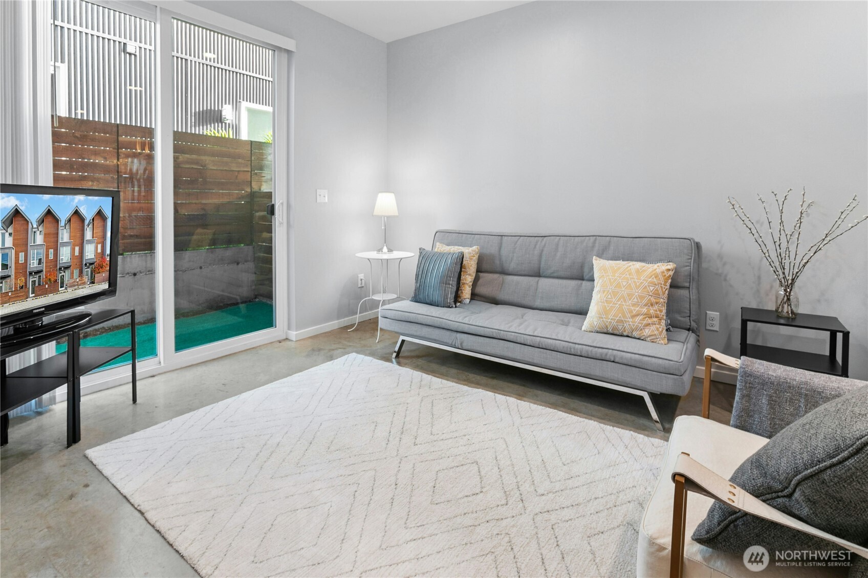 6641 Carleton Avenue South, Unit B Seattle, WA 98108 - Photo 11 of 33 a living room with furniture and a gate